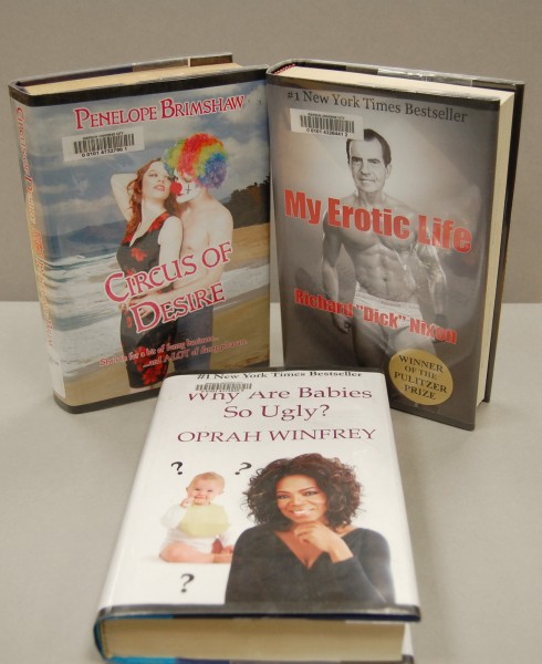 Photograph of fake book covers created by the Marxist Nudist Taxidermy Club. Titles include Circus of Desire by Penelope Brimshaw, My Erotic Life by Richard "Dick" Nixon and Why are Babies so Ugly by Oprah Winfrey