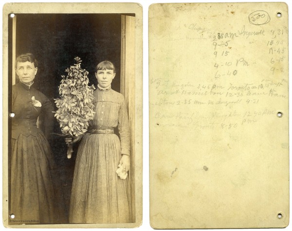 2008.001.184. [Portrait of two women in a doorway with tree branch], cabinet card [ca. 1910], 20.4 x 12.6 cm (with mount). Left: recto, right: verso.