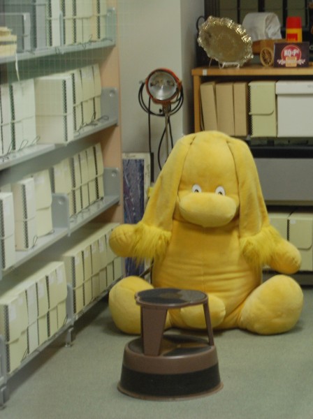 Large yellow plush Kolorkin in the Special Collection stacks