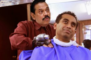 Koom Kankesan photo from book The Rajapaksa Stories with photoshopped image of the Sri Lankan p.m. as barber