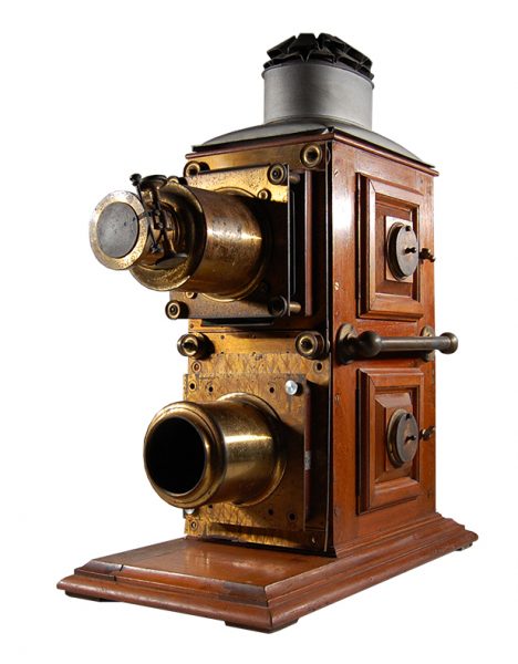 A wooden Biunial Magic Lantern projector in front of a white background
