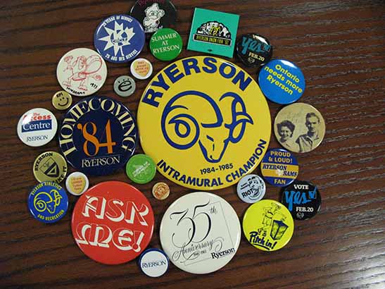 An overhead image of about 20 colourful buttons with Ryerson logos and slogans