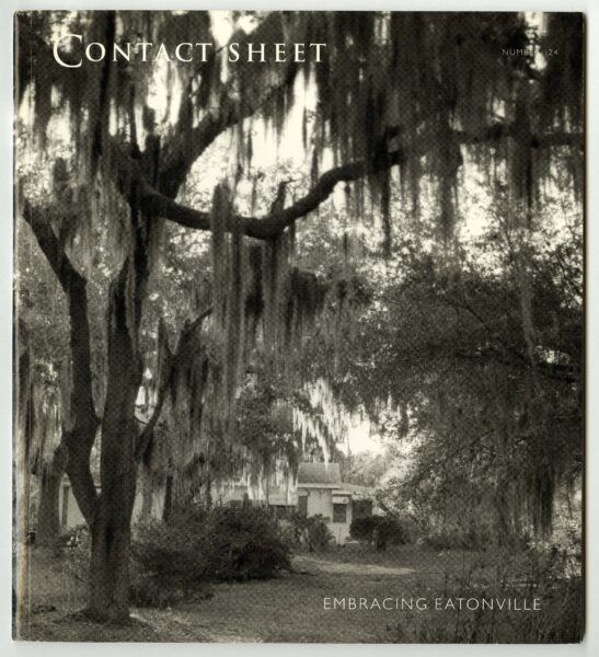 Cover of book with the text "Contact Sheet" and "Embracing Eatonville". The cover has a black and white image of a house with a large tree in front.